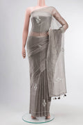 Grey Tissue Silk Saree with Embroidery on the body and Embroidery Border displayed on a mannequin