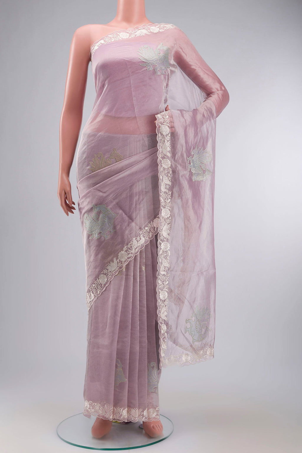 Lavender Organza Silk Saree with Embroidery on the body and Embroidery Border displayed on a mannequin