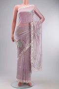 Lavender Organza Silk Saree with Embroidery on the body and Embroidery Border displayed on a mannequin