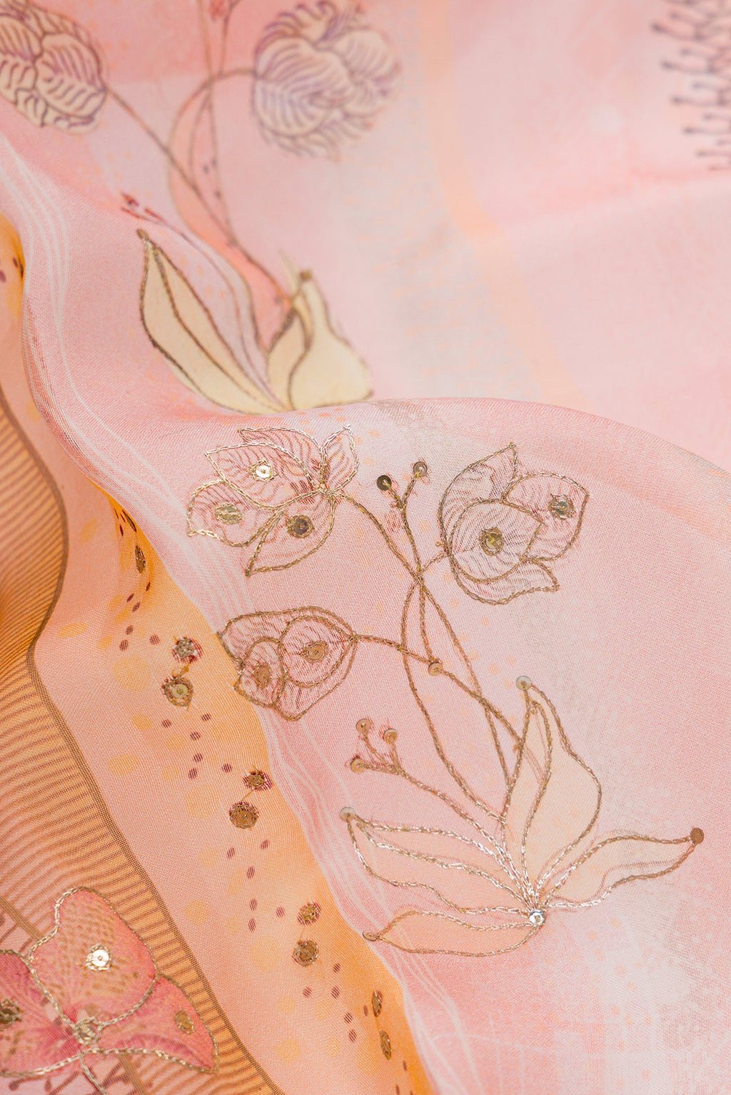 Close up of Pink Dual Tone Organza Silk Saree with Embroidery on the body and Embroidery Border.  displaying folds