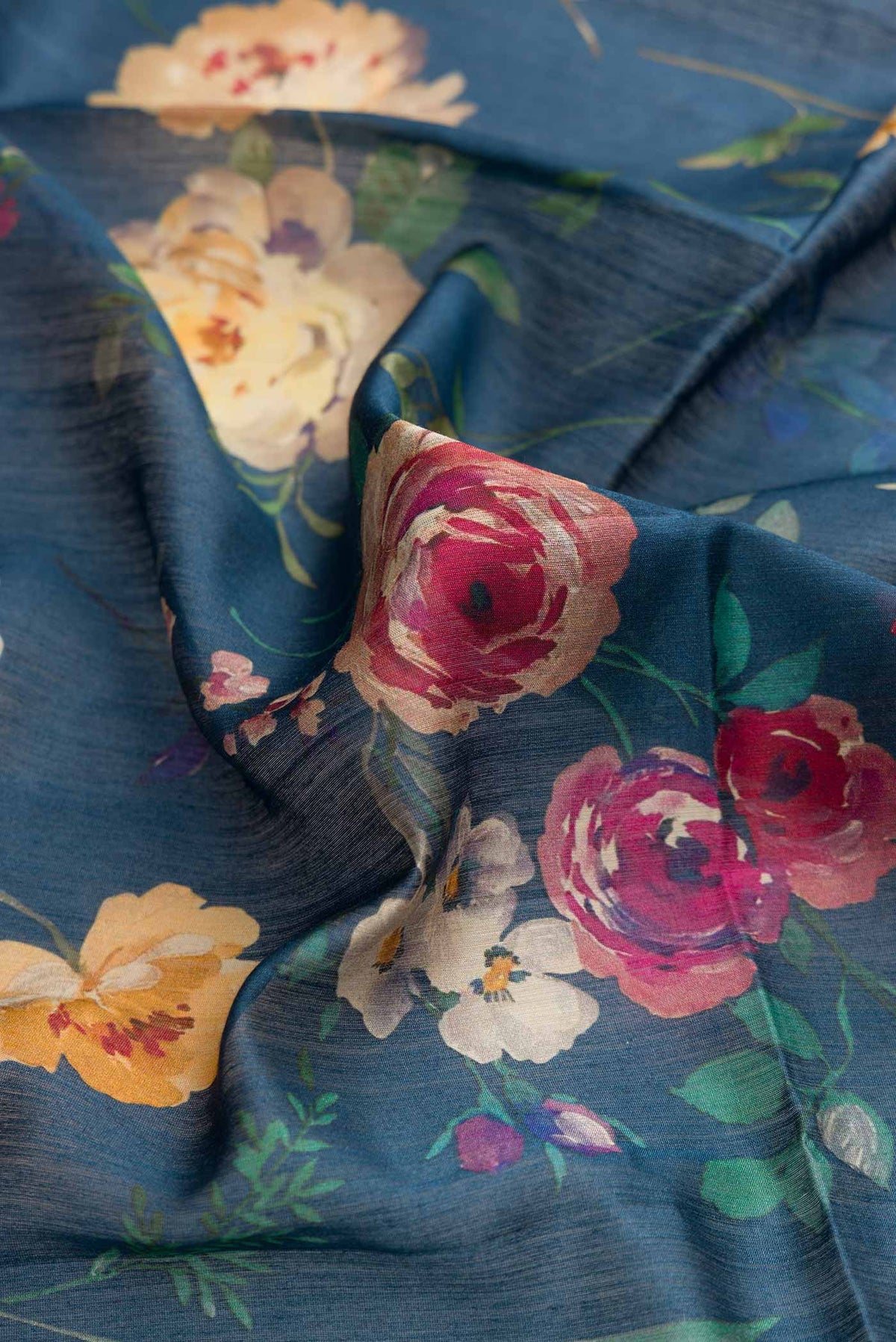 Close up of Blue Dual Tone Tussar Silk Saree with Printed design on the body and Zari Border displaying folds