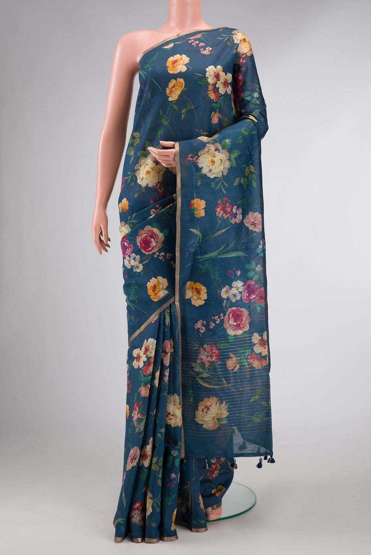 Blue Dual Tone Tussar Silk Saree with Printed design on the body and Zari Border displayed on a mannequin