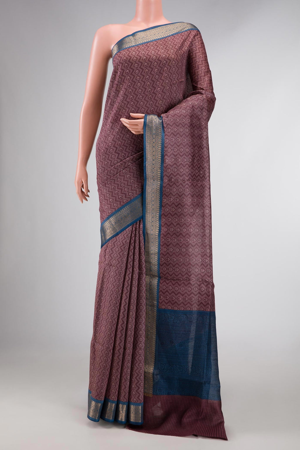 Burgundy Dual Tone Tussar Silk Saree with Printed design on the body and Zari Border displayed on a mannequin