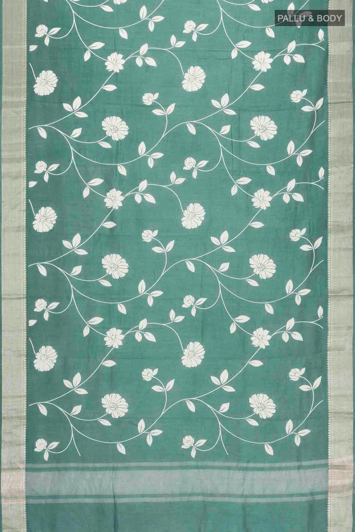 Flat view of Green Tussar Silk Saree with Printed design on the body and Zari Border