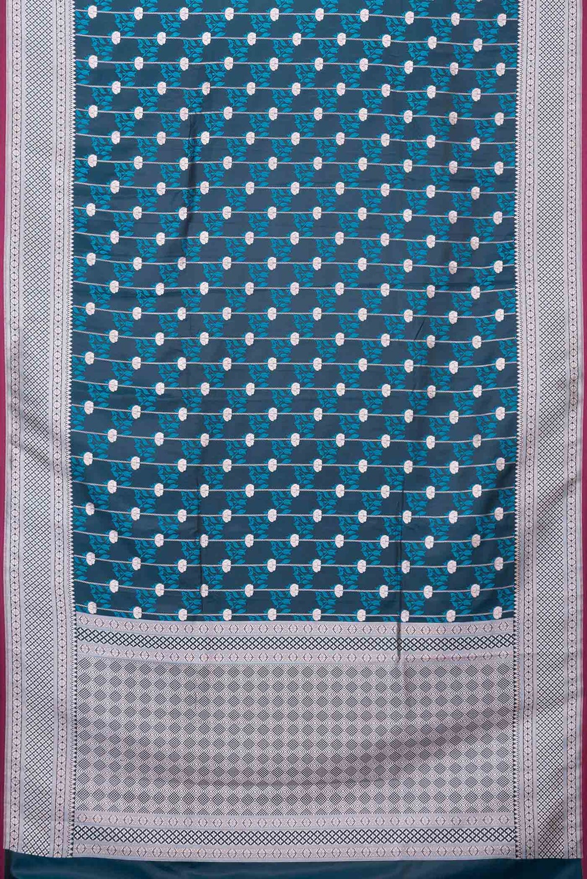 Flat view of Peacock Blue Dual Tone Blended Banarasi Silk Saree with Zari Butta on the body and Zari Border. 