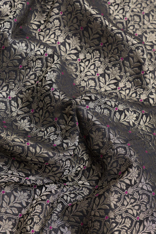 Close up of Black Dual Tone Banarasi Georgette Saree with Zari Brocade on the body and Zari Border.  displaying folds
