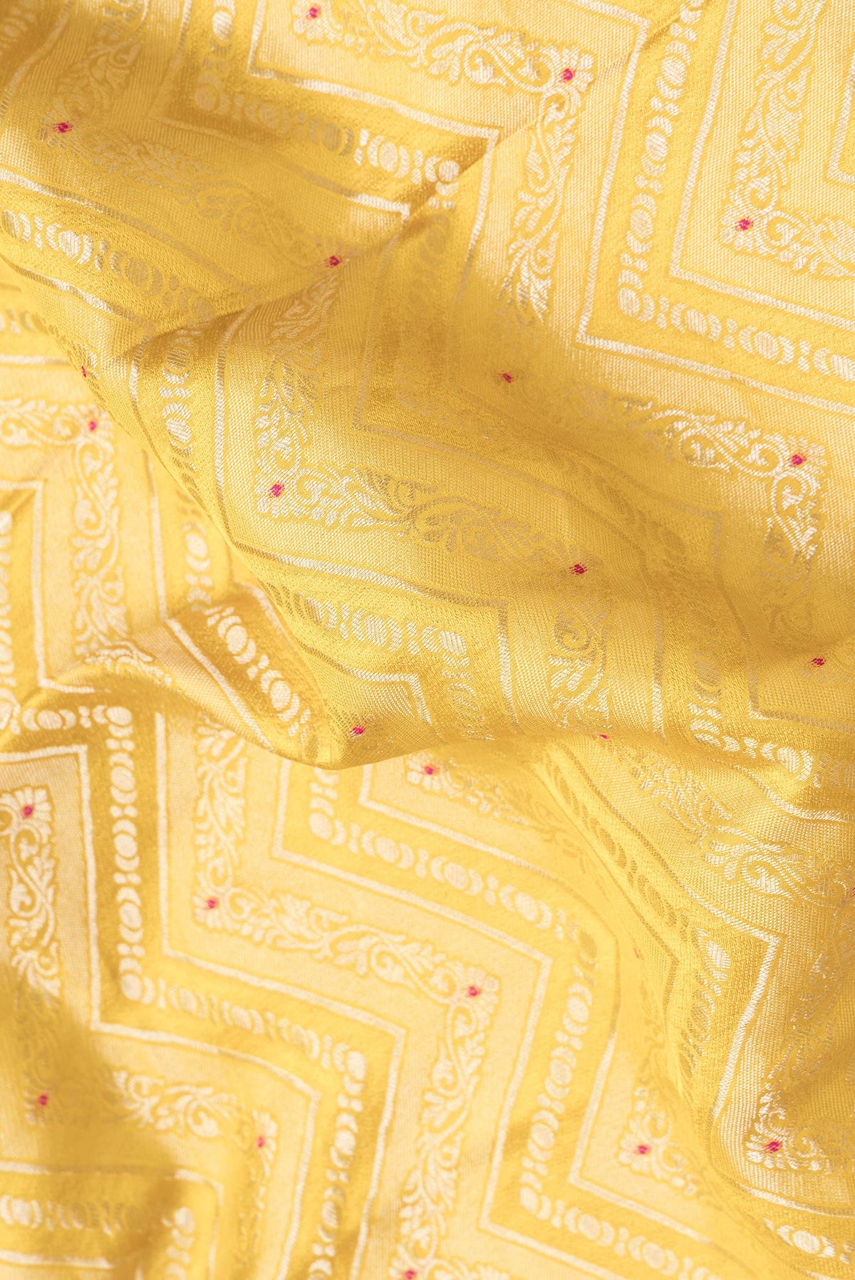 Close up of Yellow Dual Tone Banarasi Georgette Saree with Zari Brocade on the body and Zari Border.  displaying folds