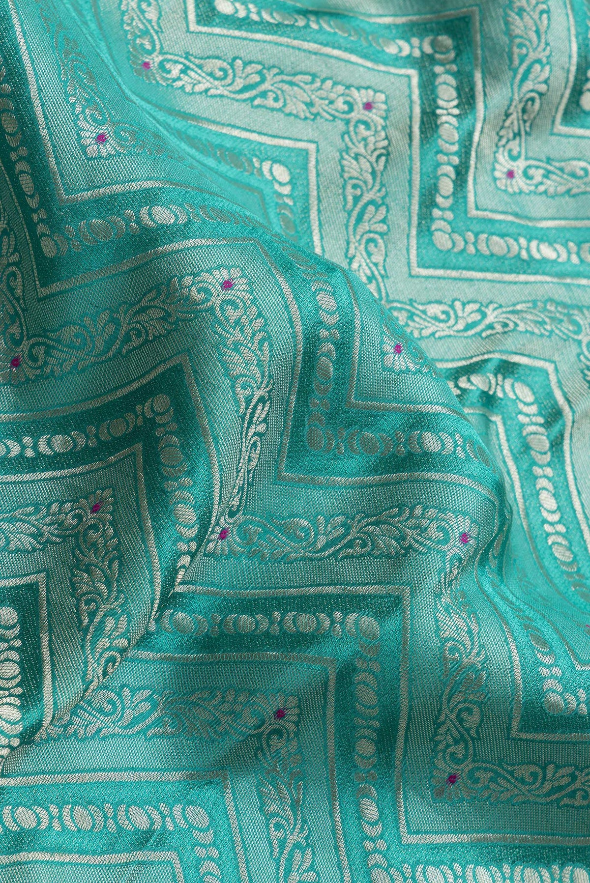 Close up of Sea Green Dual Tone Tussar Silk Saree with Zari Brocade on the body and Zari Border.  displaying folds