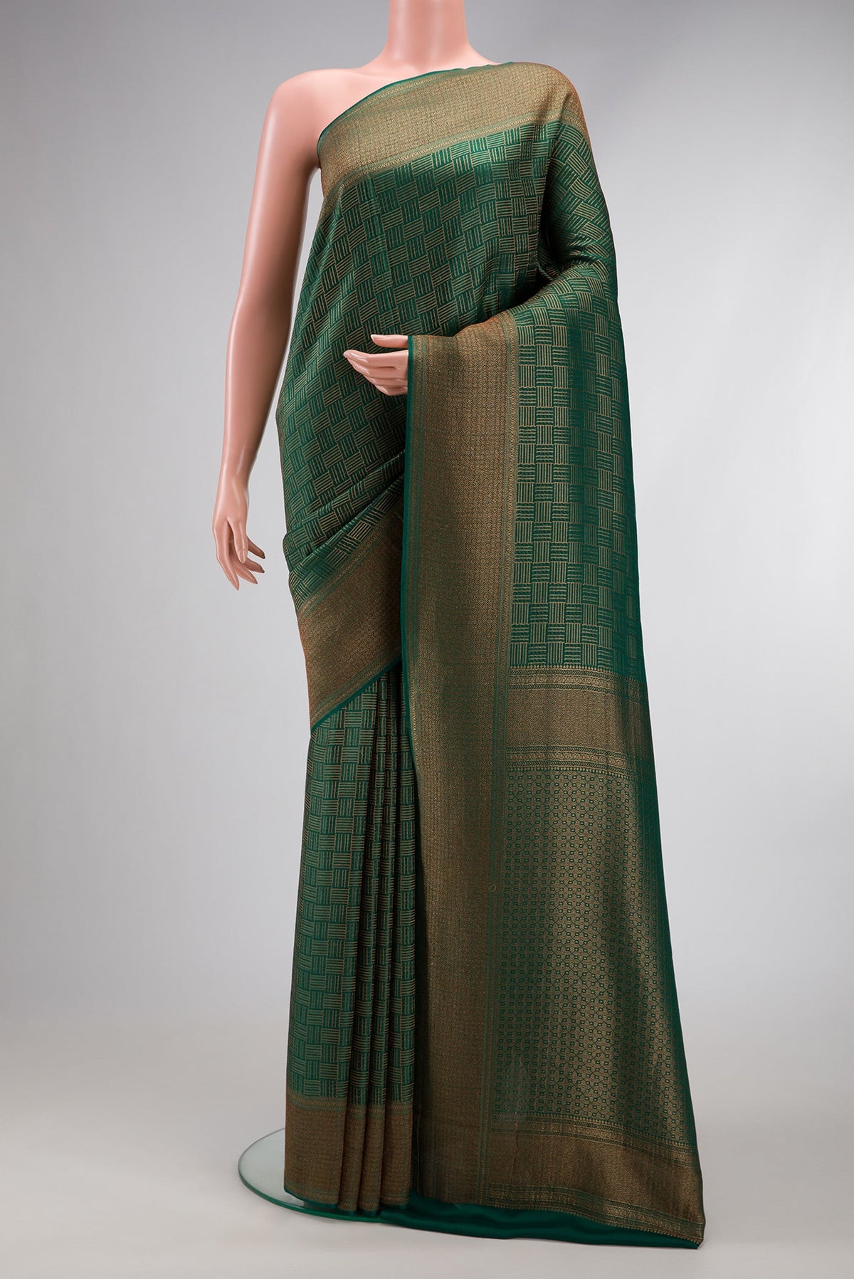 Bottle Green Dual Tone Mysore Crepe Saree with Zari Brocade on the body and Zari Border.  displayed on a mannequin