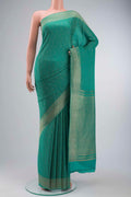 Teal Mysore Crepe Saree with Stripes on the body and Zari Border displayed on a mannequin