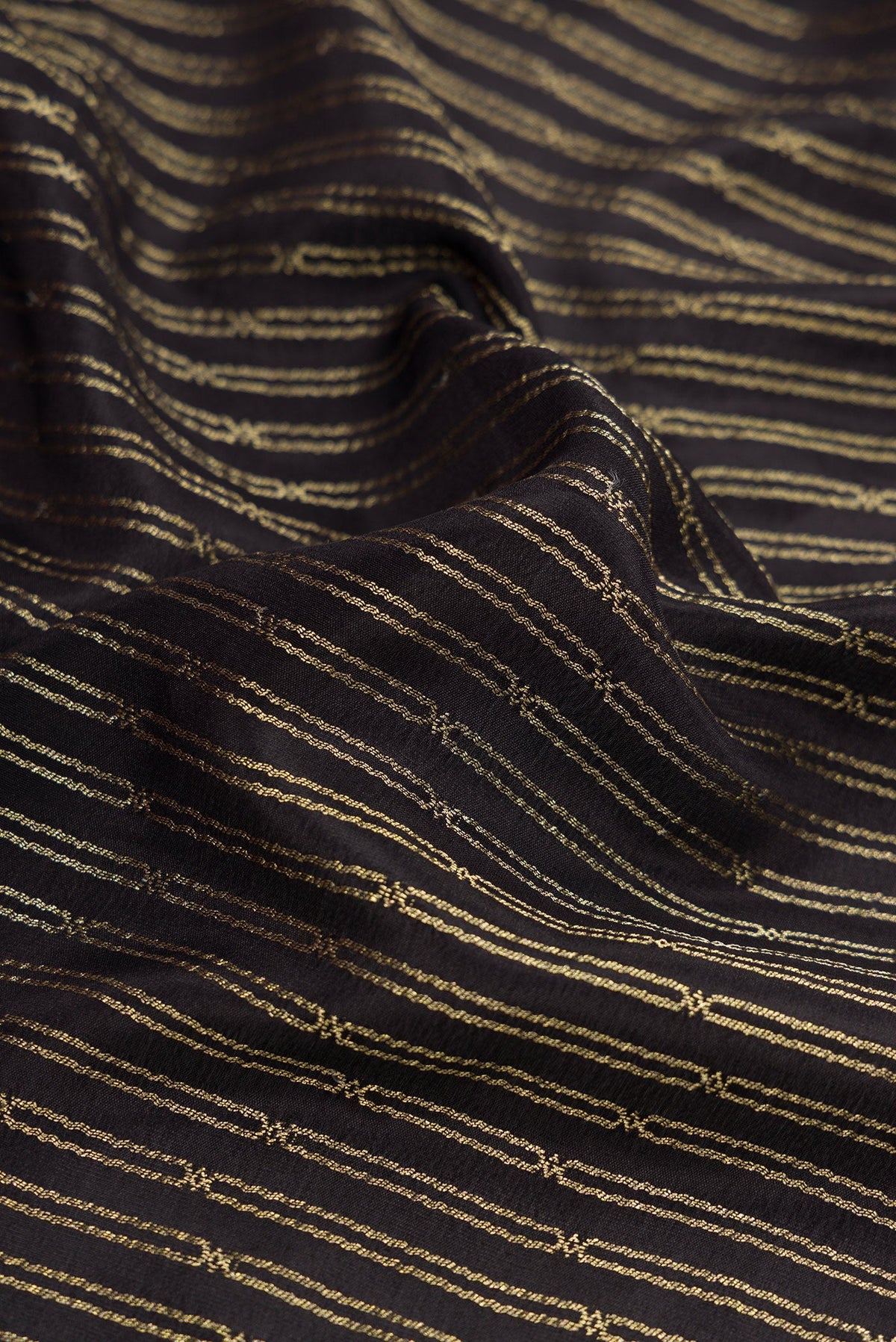 Close up of Black Mysore Crepe Saree with Stripes on the body and Zari Border.  displaying folds