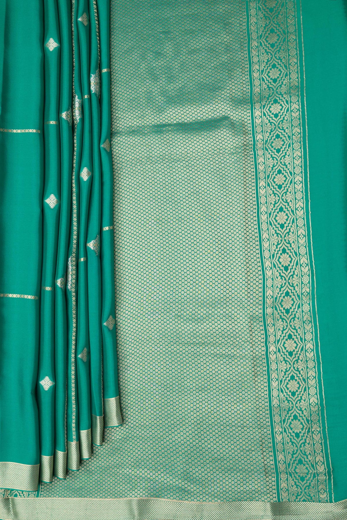 Pleats and pallu of Sea Green Dual Tone Banarasi Georgette Saree with Zari Butta on the body and Zari Border. 