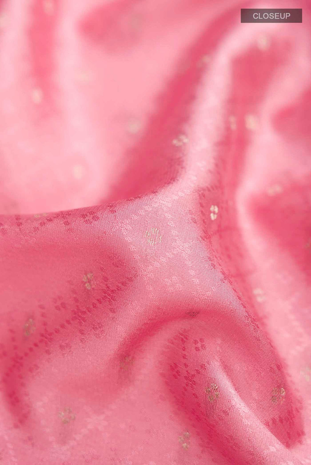 Close up of Pink Mysore Crepe Saree with Jacquard With Zari Butta on the body and Zari Border displaying folds