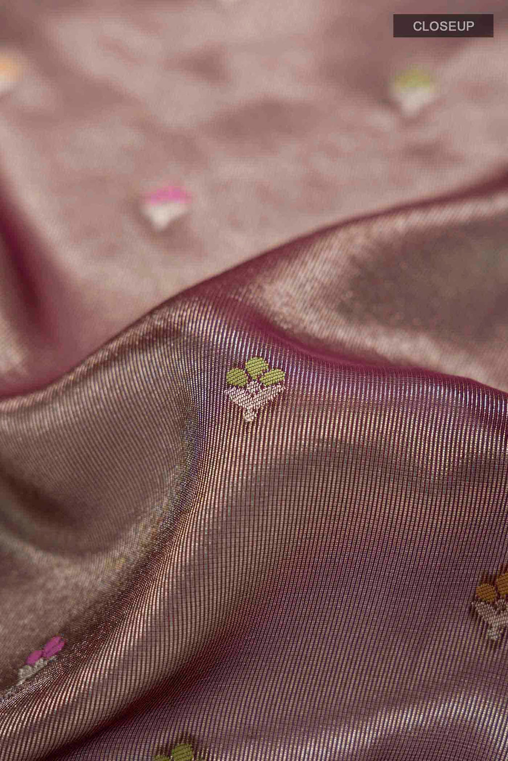 Close up of Brown Banarasi Silk Saree with Zari Butta on the body and Zari Border displaying folds