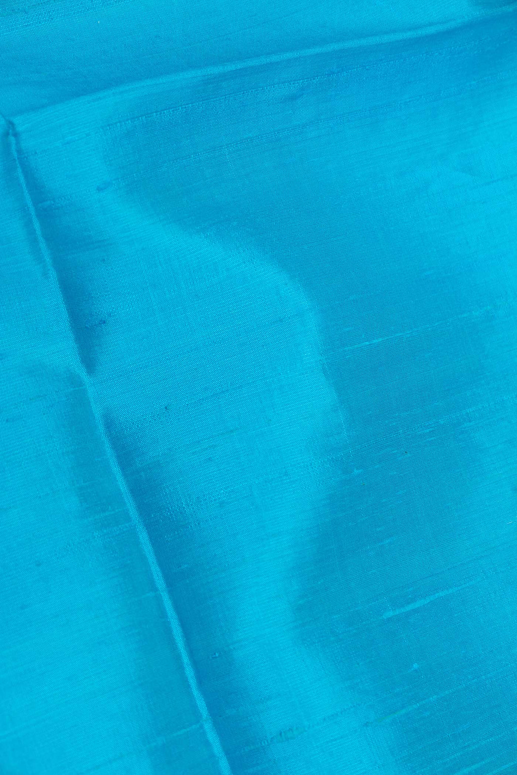 Close up of Sky Blue Dual Tone Raw Silk Saree with Plain Body and Zari Border displaying folds