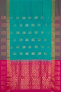 Peacock Blue Dual Tone Soft Silk Saree with Zari Butta on the body and Fancy Border.  displayed on a mannequin