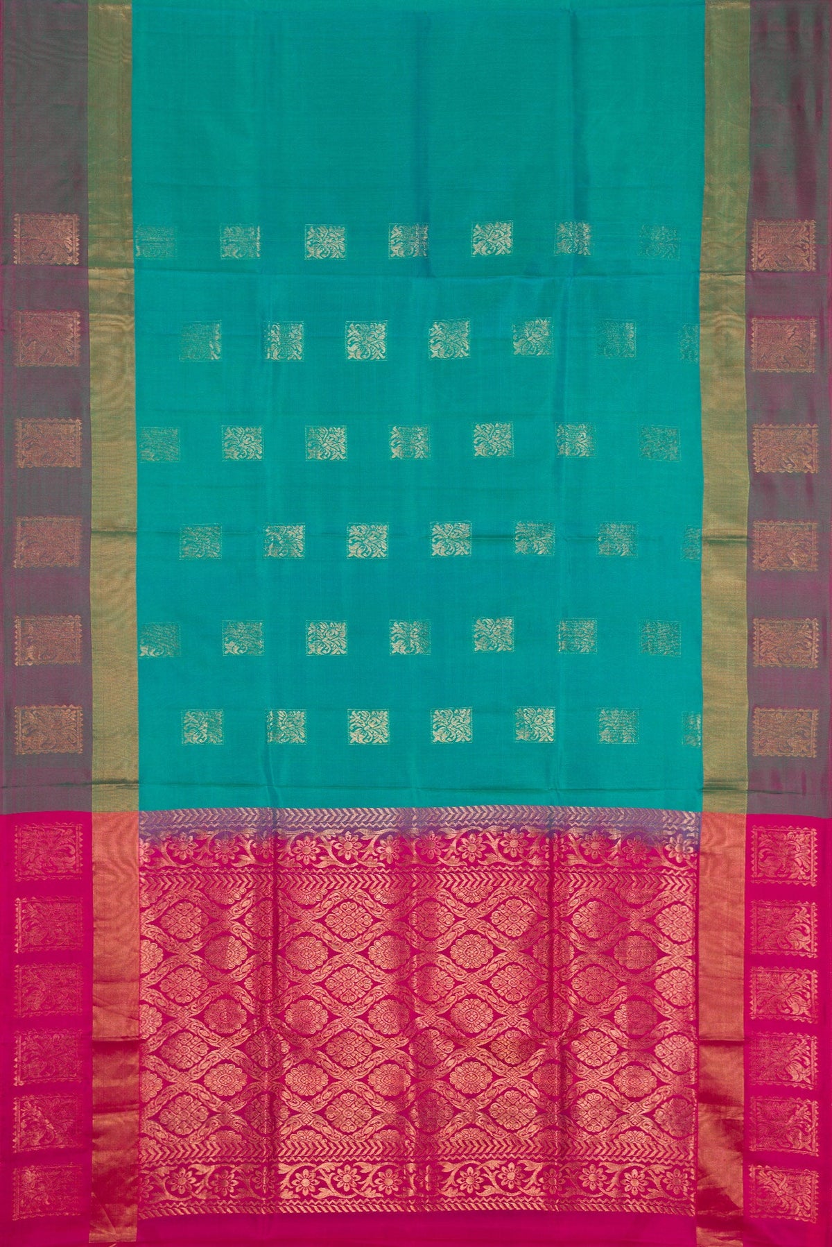 Flat view of Peacock Blue Dual Tone Soft Silk Saree with Zari Butta on the body and Fancy Border. 