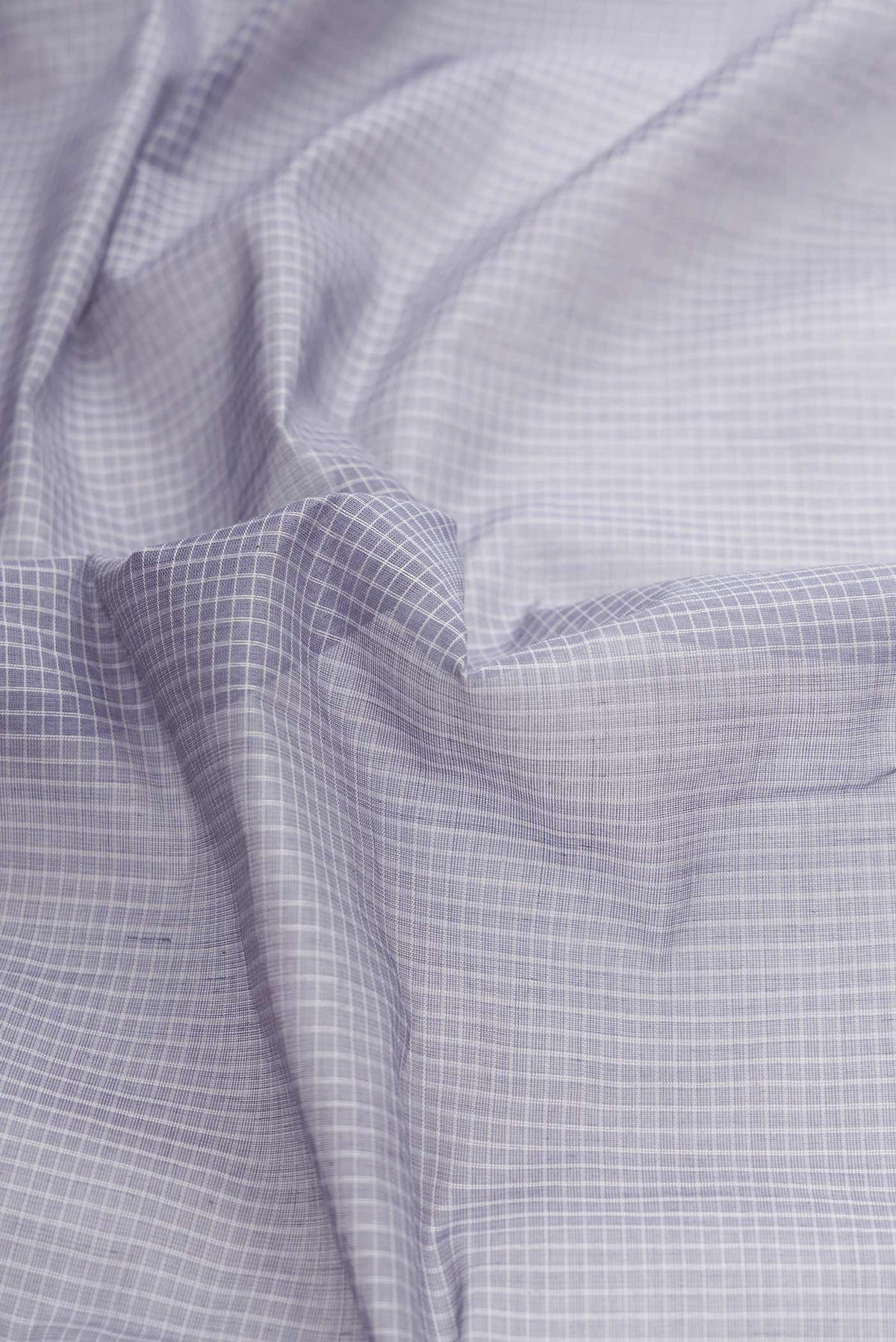 Close up of Light Blue Dual Tone Gadwal cotton Saree with Checked design on the body and Zari Border displaying folds