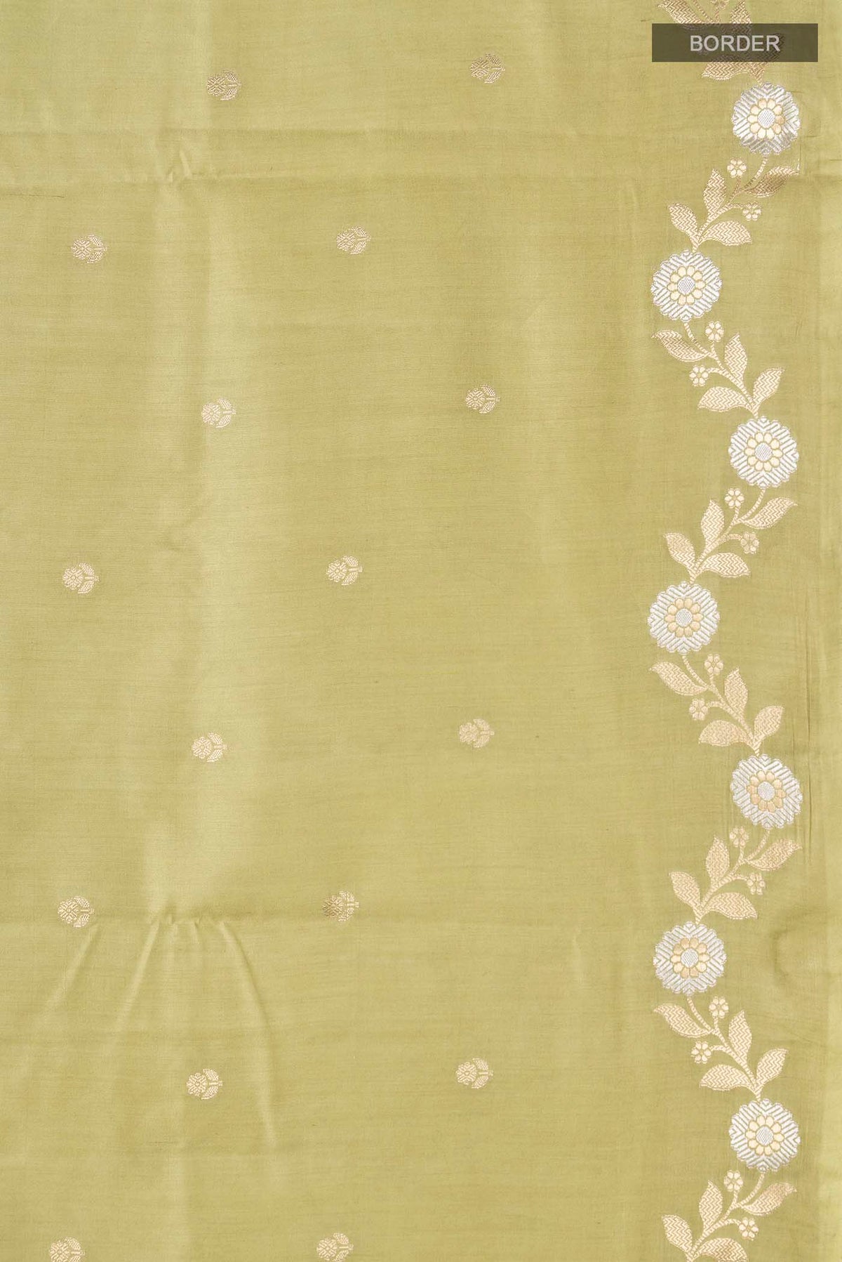 Border image of Green Banarasi Raw Silk Saree with Zari Butta on the body and Zari Border