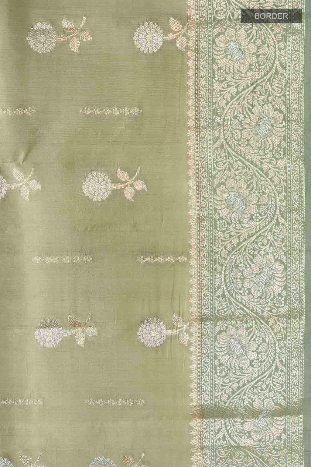 Border image of Green Banarasi Raw Silk Saree with Zari Butta on the body and Zari Border