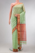 Pista Green Dual Tone Maheshwari Silk Saree with Checked design on the body and Zari Border.  displayed on a mannequin