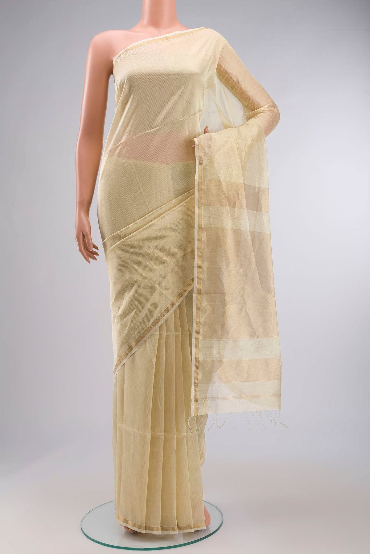 Beige Maheshwari Silk Saree with Stripes on the body and Zari Border displayed on a mannequin