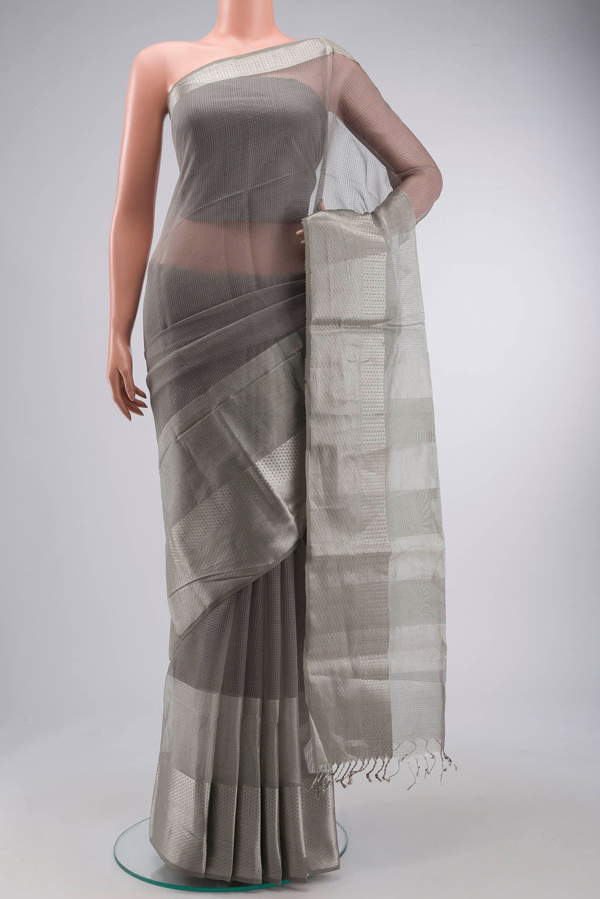 Grey Maheshwari Silk Saree with Stripes on the body and Zari Border displayed on a mannequin