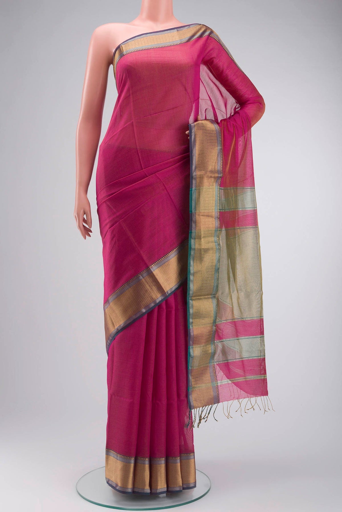 Pink Maheshwari Silk Cotton Saree with Checked design on the body and Zari Border displayed on a mannequin