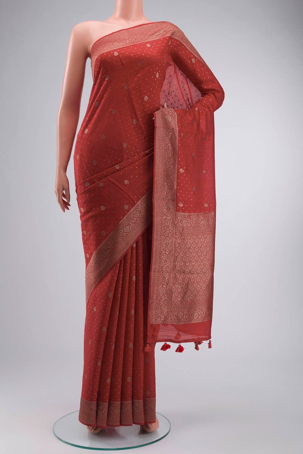 Red Raw Silk Saree with Zari Butta on the body and Zari Border displayed on a mannequin