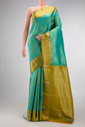 Sea Green Dual Tone Kanchipuram Silk Saree with Zari Brocade on the body and Zari Border.  displayed on a mannequin