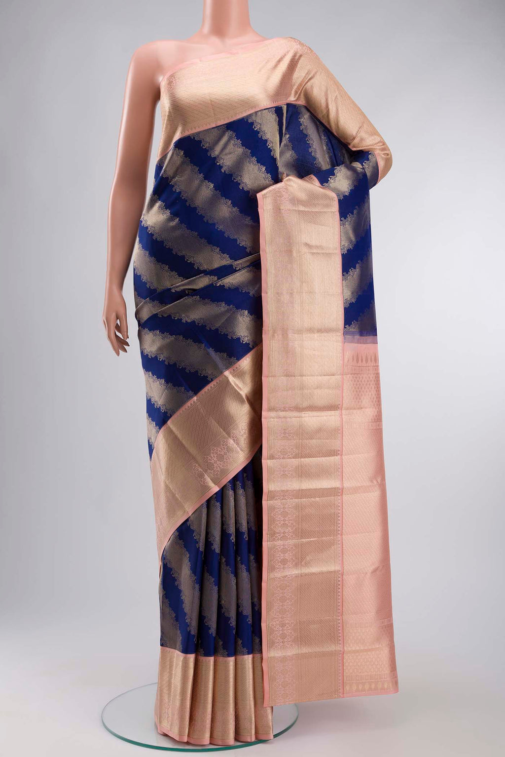 Blue Kanchipuram Silk Saree with Zari Butta on the body and Zari Border displayed on a mannequin