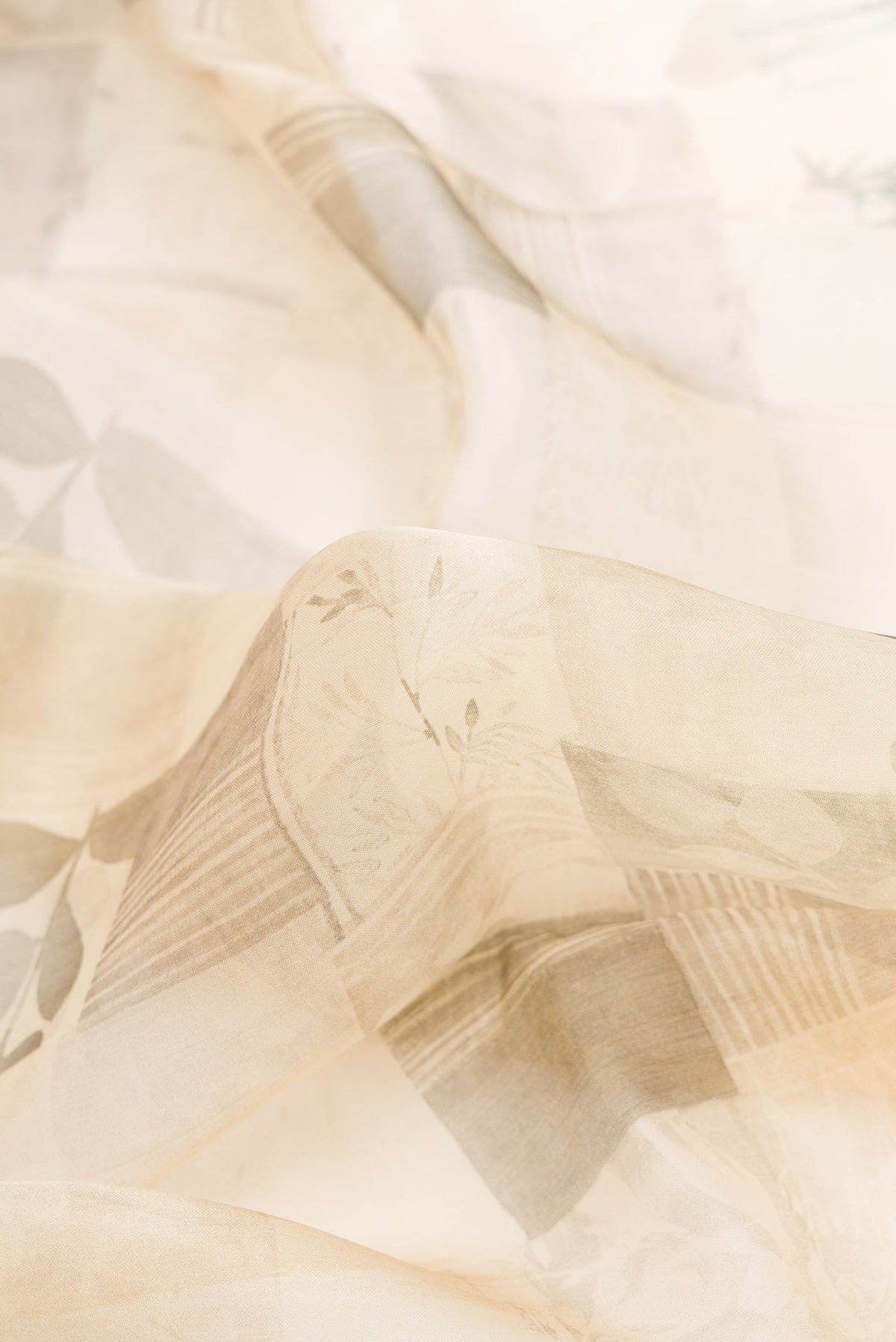 Close up of Sandal Dual Tone Organza Silk Saree with Printed design on the body and Zari Border.  displaying folds
