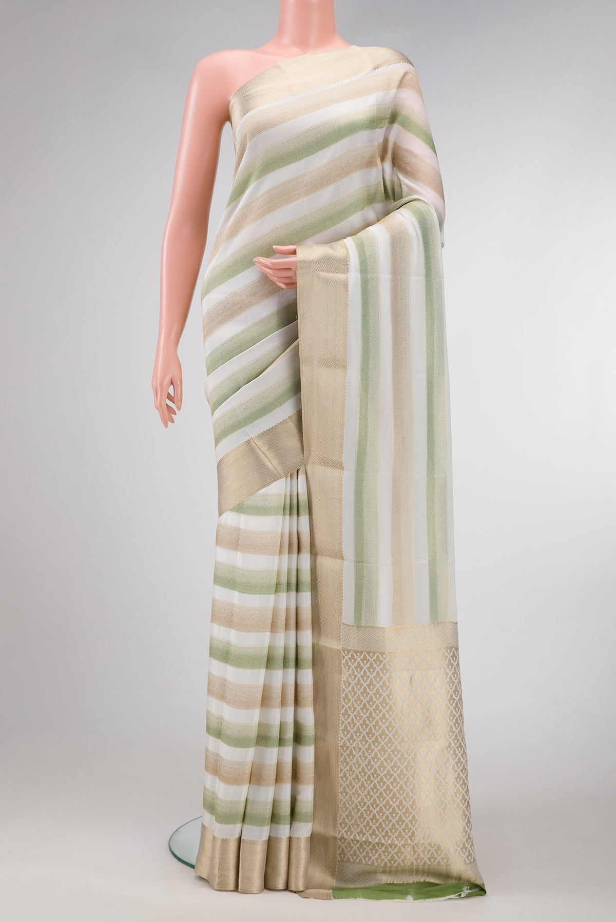 Offwhite , Green and Beige Color Mysore Silk Saree with Stripes on the body and Zari Border.  displayed on a mannequin