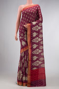 Burgundy Dual Tone Tussar Silk Saree with Printed design on the body and Zari Border.  displayed on a mannequin