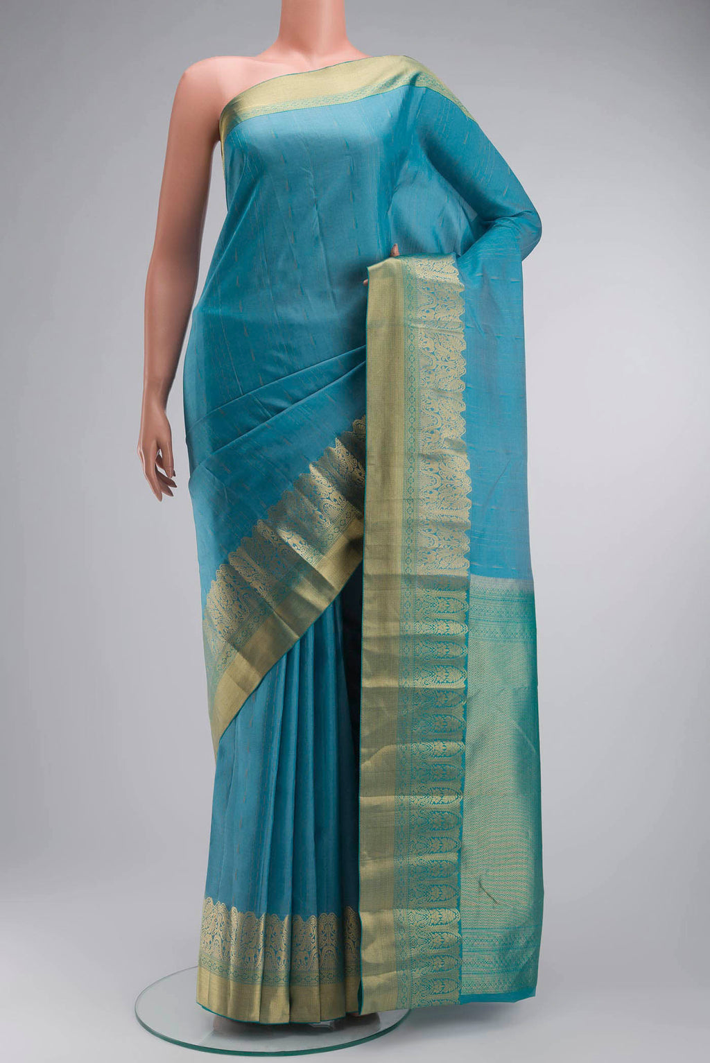 Blue Kanchipuram Silk Saree with Zari Butta on the body and Zari Border displayed on a mannequin