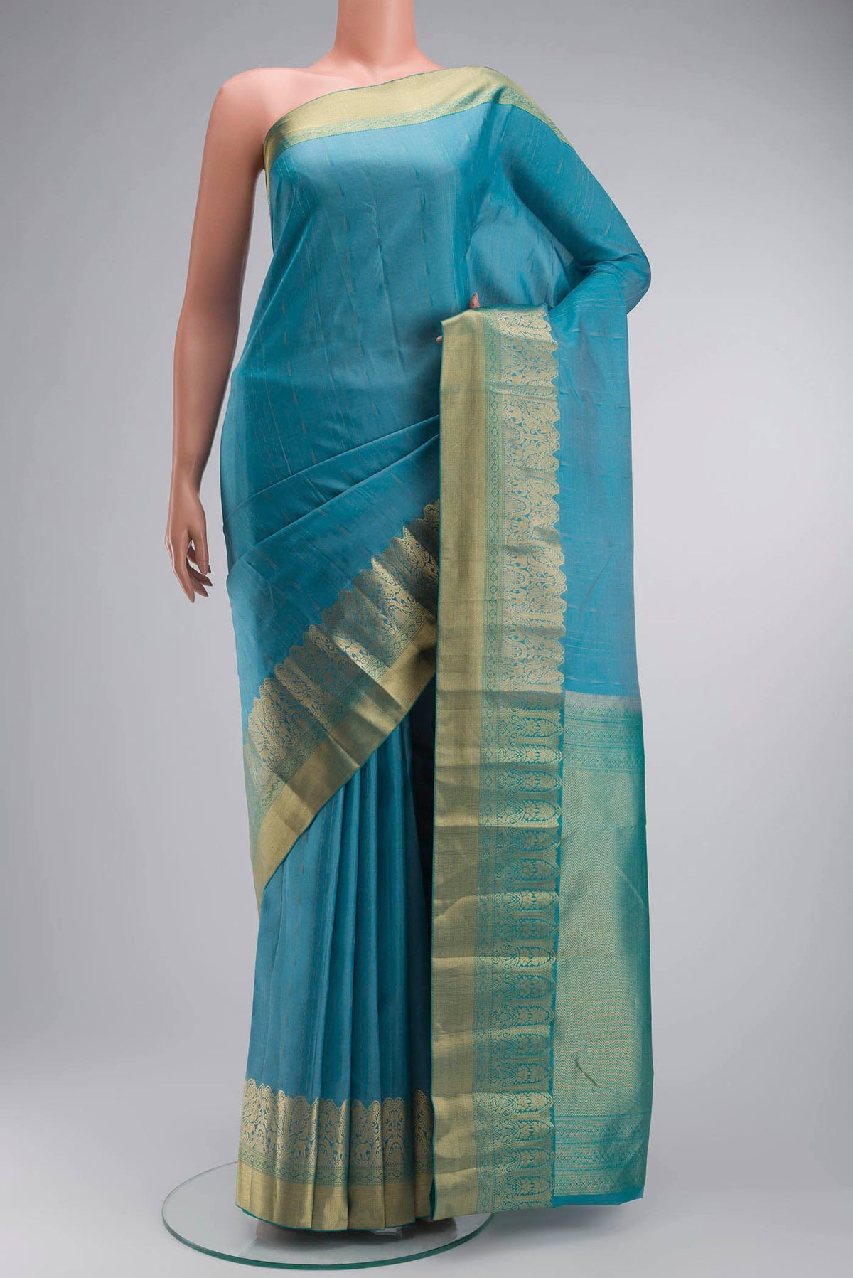 Blue Kanchipuram Silk Saree with Zari Butta on the body and Zari Border displayed on a mannequin