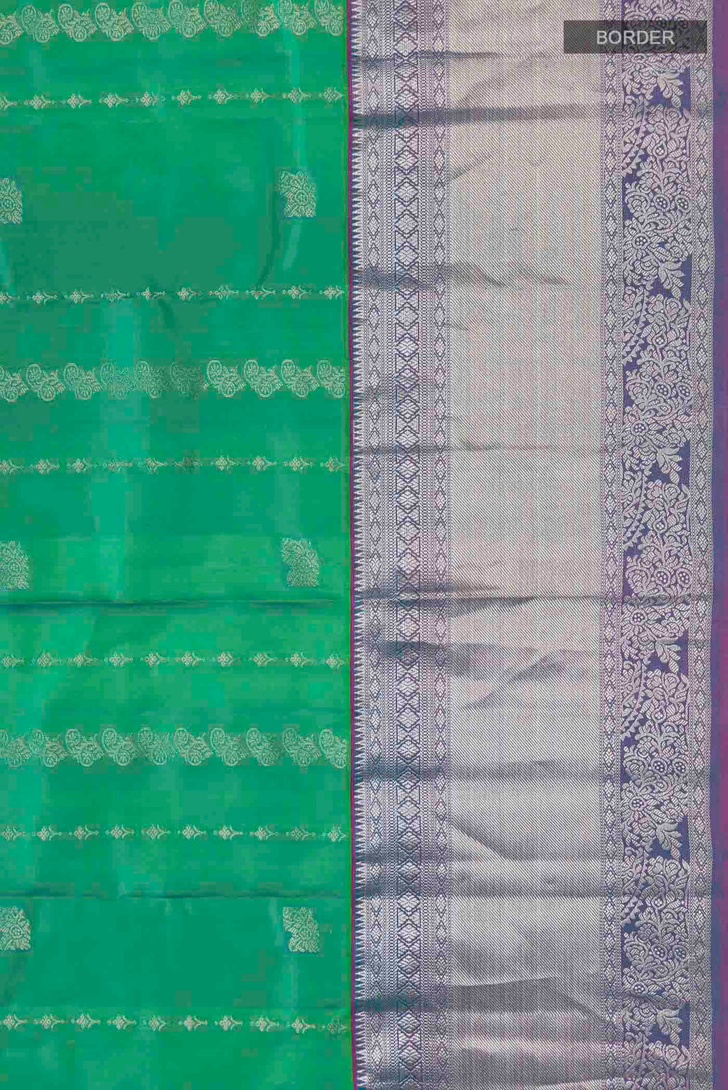 Border image of Green Kanchipuram Silk Saree with Zari Butta on the body and Zari Border