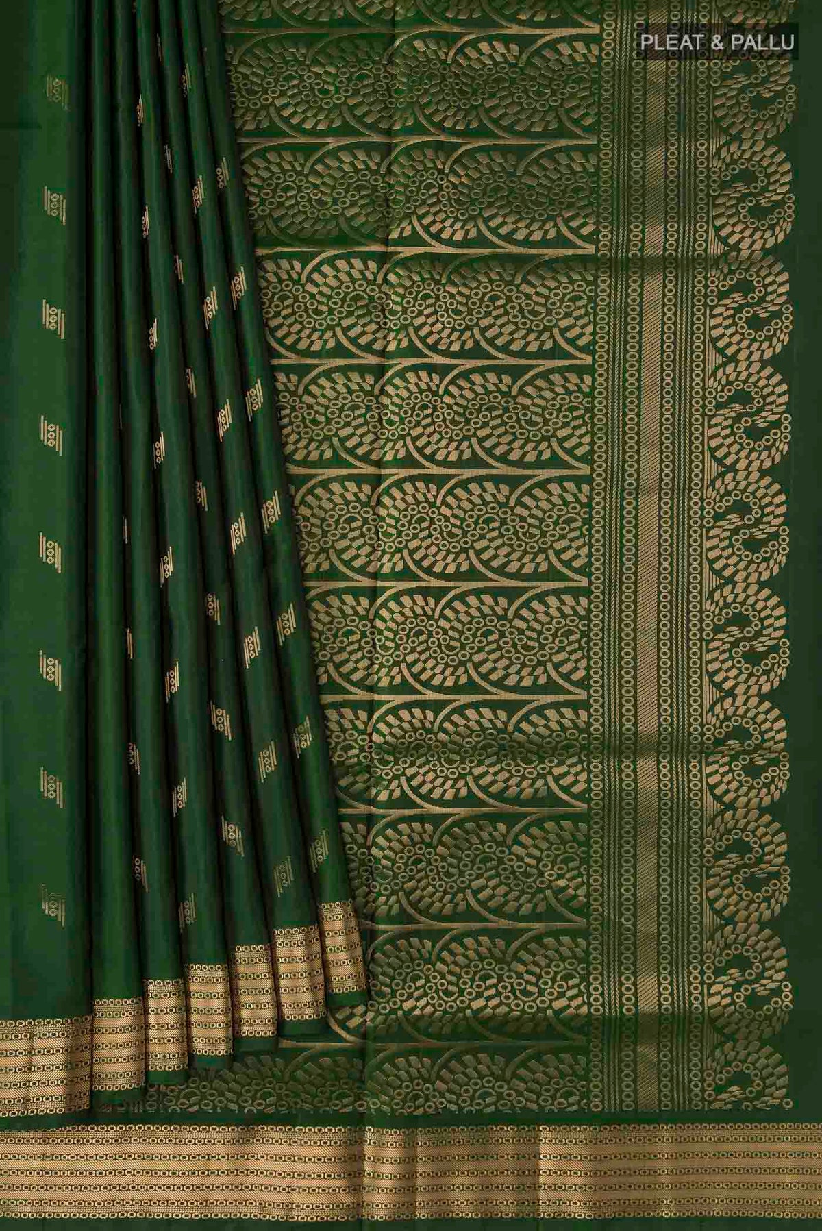 Pleats and pallu of Green Soft Silk Saree with Zari Butta on the body and Zari Border