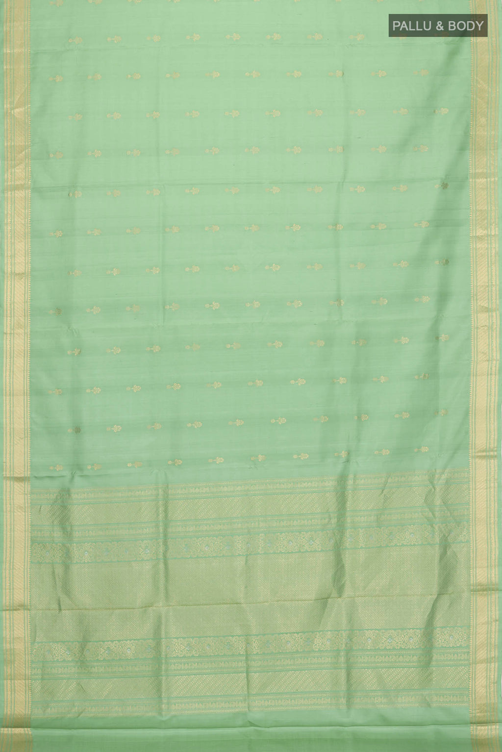 Flat view of Green Soft Silk Saree with Zari Butta on the body and Zari Border