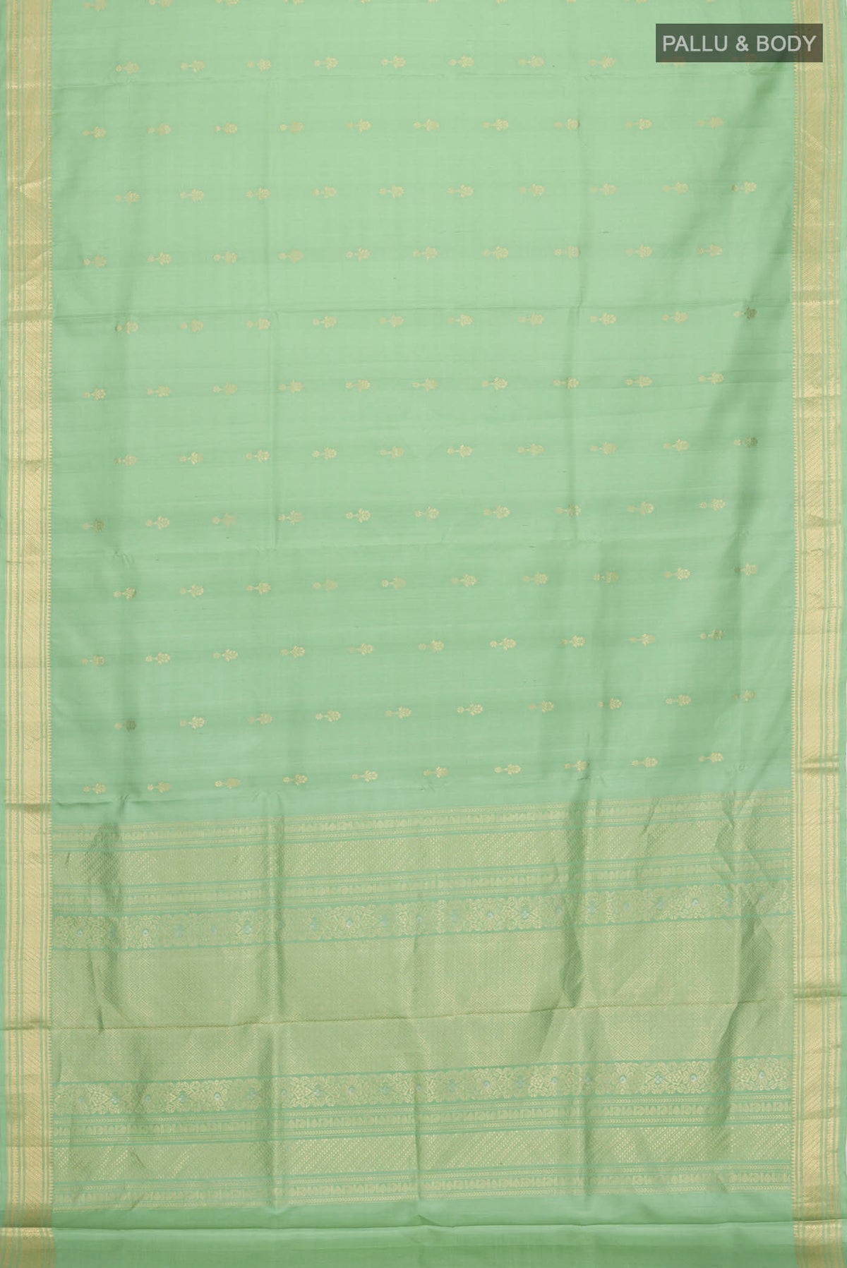 Flat view of Green Soft Silk Saree with Zari Butta on the body and Zari Border