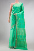 Light Green Dual Tone Soft Silk Saree with Zari Butta on the body and Zari Border displayed on a mannequin