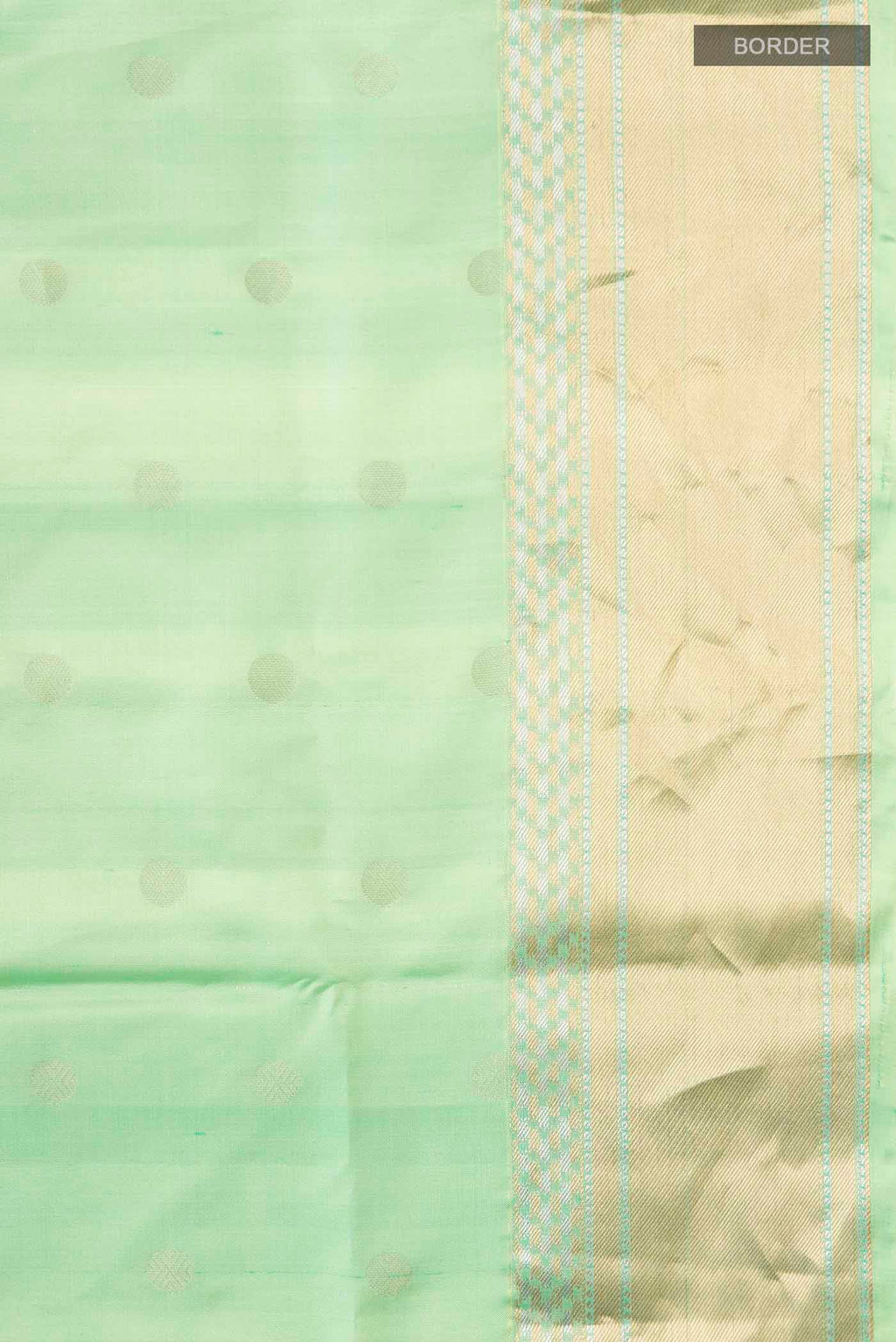 Border image of Green Soft Silk Saree with Zari Butta on the body and Zari Border