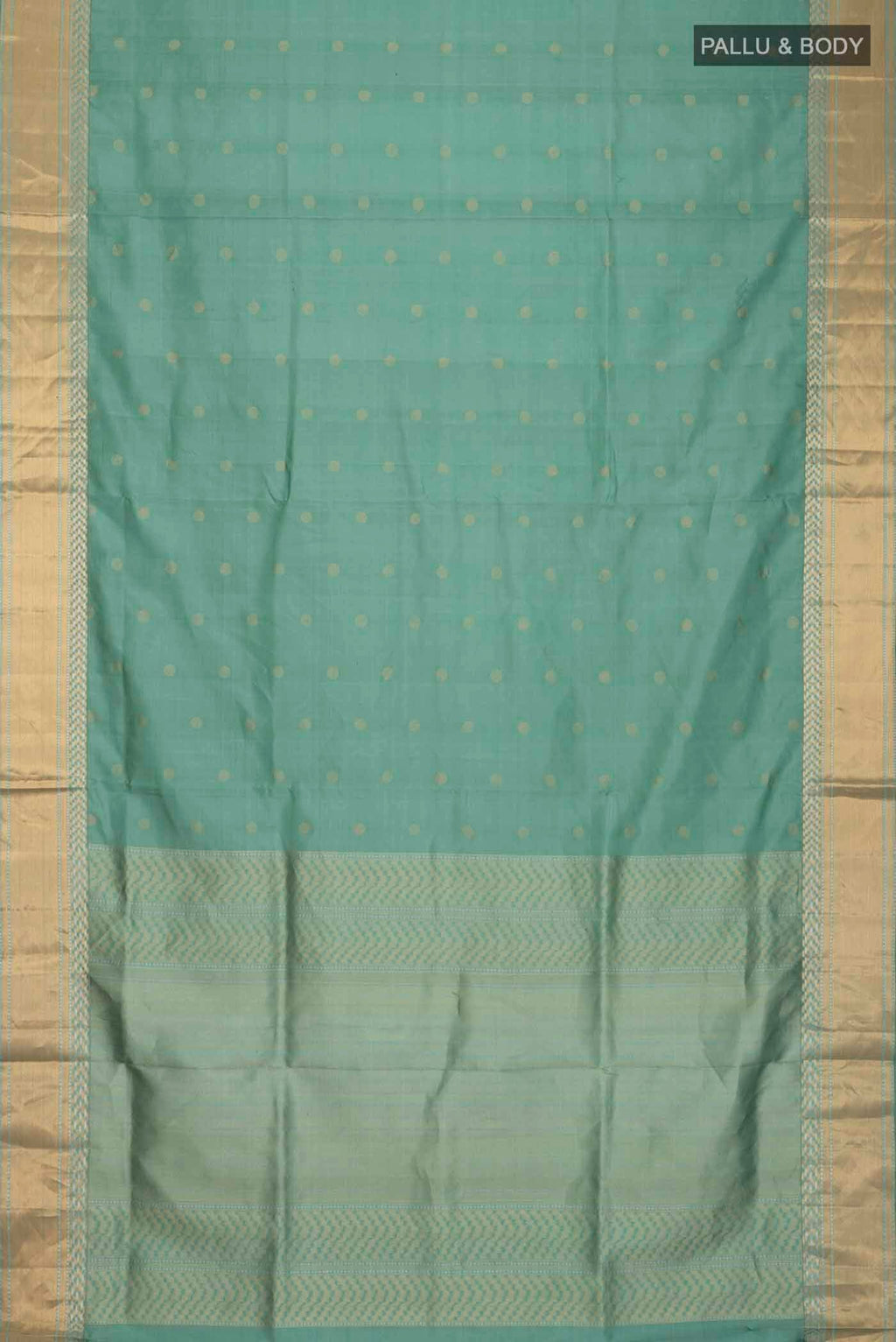 Flat view of Green Soft Silk Saree with Zari Butta on the body and Zari Border