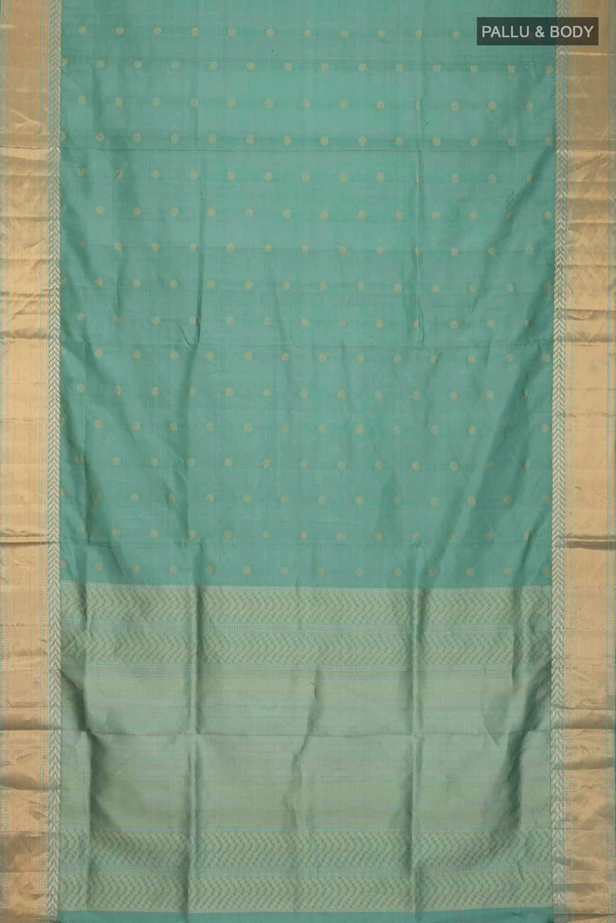 Flat view of Green Soft Silk Saree with Zari Butta on the body and Zari Border