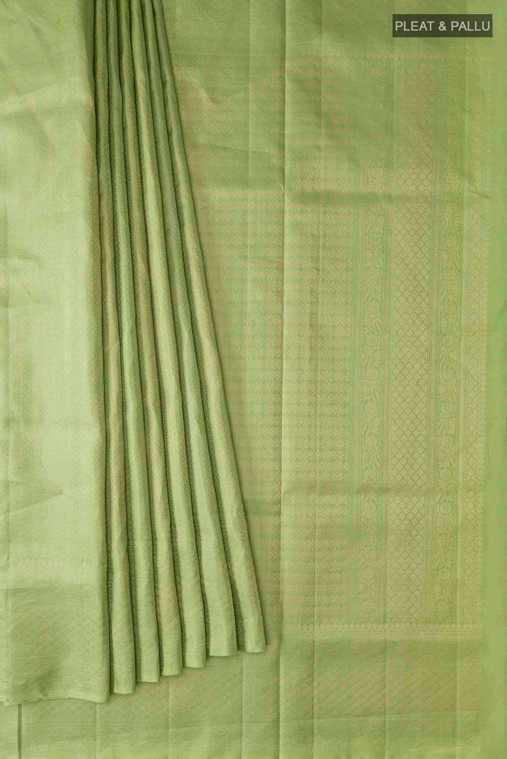 Pleats and pallu of Green Soft Silk Saree with Zari Brocade on the body and Zari Border