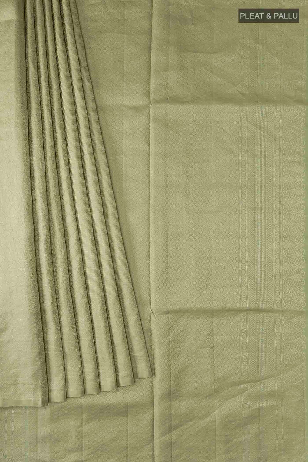 Pleats and pallu of Green Soft Silk Saree with Zari Butta on the body and Zari Border