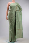 Green Soft Silk Saree with Zari Brocade on the body and Zari Border displayed on a mannequin