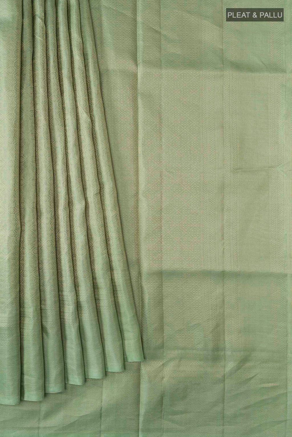 Pleats and pallu of Green Soft Silk Saree with Zari Brocade on the body and Zari Border