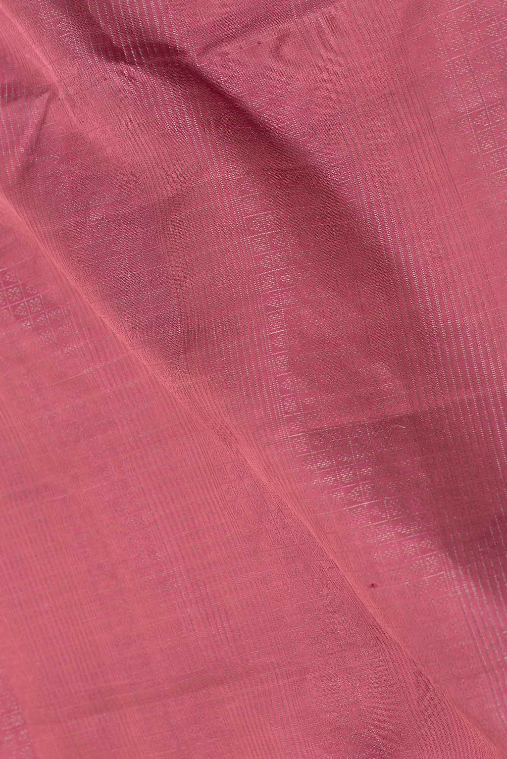 Close up of Rani Pink Dual Tone Soft Silk Saree with Zari Brocade on the body and Zari Border displaying folds