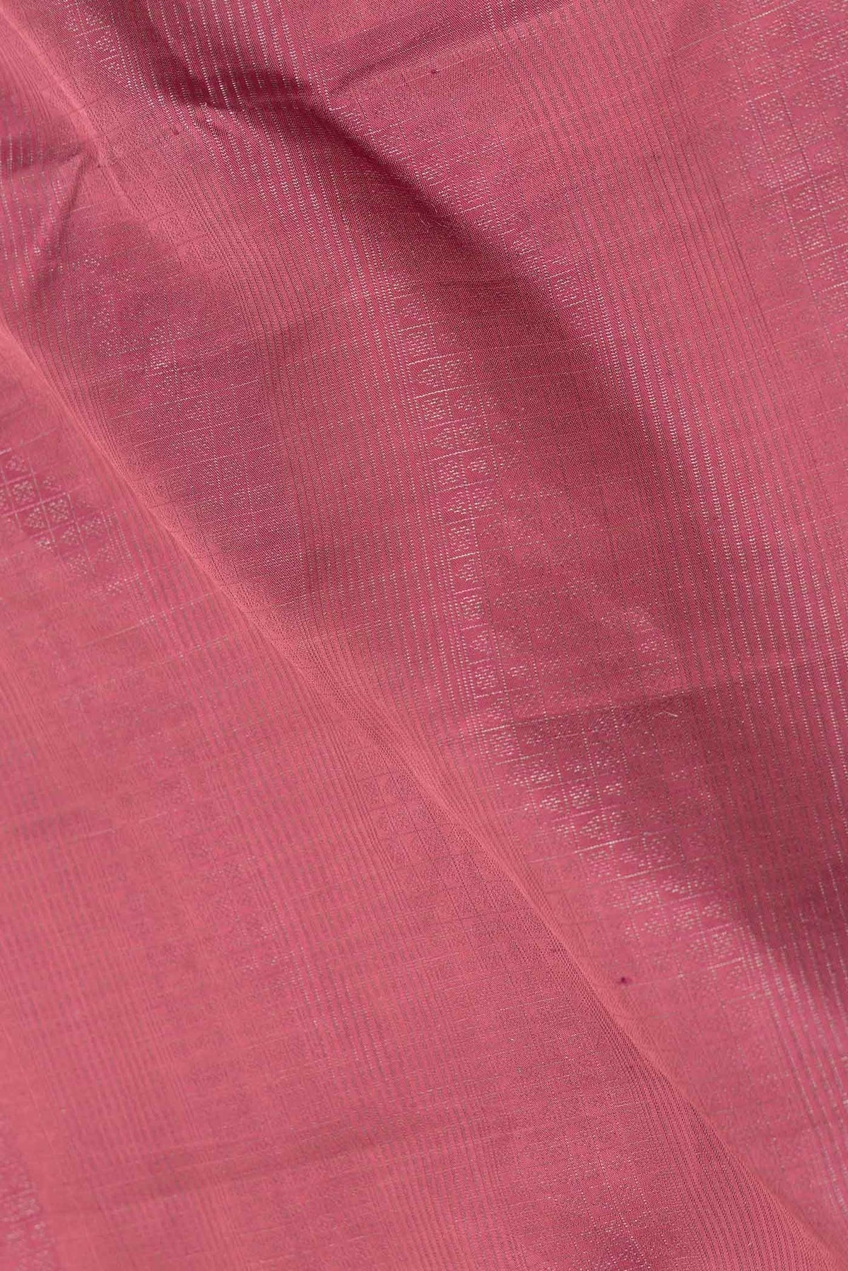 Close up of Rani Pink Dual Tone Soft Silk Saree with Zari Brocade on the body and Zari Border displaying folds